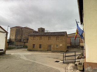 Fototapeta premium Traditional adobe house with green wooden door in Quintanilla de Palencia