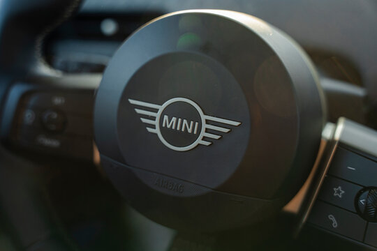January 24, 2026, Amsterdam, Netherlands - Close-up of a Mini Cooper steering wheel with logo and control buttons