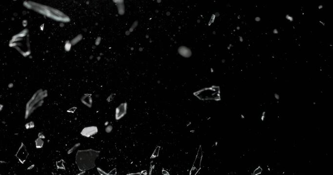 This striking visual of glass breakage displays shards scattering on a deep black background, perfect for captivating motion graphics and enhancing visual storytelling in various projects