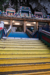 Steps of Batu Caves, a famous shrine and limestone hill complex, known for its stunning cave temples and the giant stature of Lord Murugan near Kuala Lumpur, Malaysia