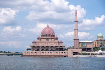 Masjid Putra or Putra Mosque, a famous rosy pink granite primary mosque in Putrajaya, blending Middle Eastern and Malay styles. With the view of Putrajaya Lake