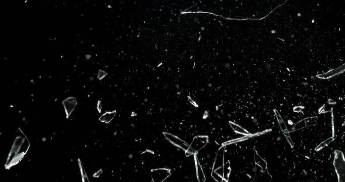 This footage features stunning glass shattering effects against a deep black background, ideal for enhancing motion graphics and creating captivating visual effects that engage the audience