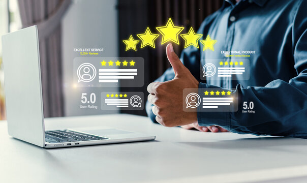 Businessman showing thumbs up with 5-star rating hologram. Concept of excellent customer service, user satisfaction, positive feedback, and successful business reputation management.