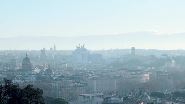 Rome winter sunrise skyline from Gianicolo with Vittoriano, Campidoglio, Ara Coeli, and Jewish Synagogue, smoking chimneys, 4K