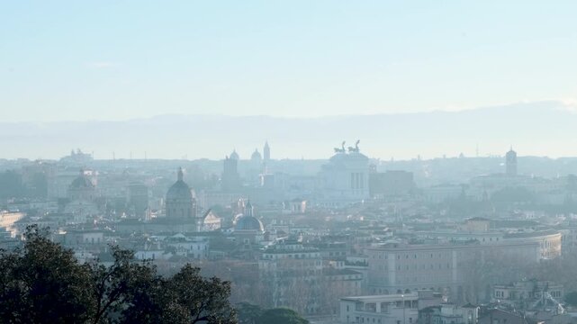Rome winter sunrise skyline from Gianicolo with Vittoriano, Campidoglio, and Ara Coeli, smoking chimneys, 4K
