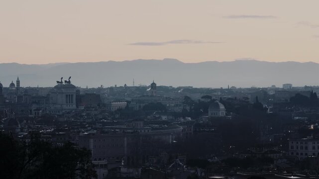 Rome winter skyline at sunrise from Gianicolo with Vittoriano, Campidoglio, Ara Coeli, Synagogue, and Colosseum