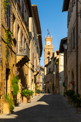Naklejka premium Corso Il Rossellino street with Palazzo Comunale clock tower, Pienza