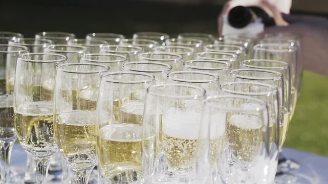 Glasses of champagne on the street, slow motion