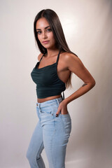 Brunette girl with long hair in a studio session