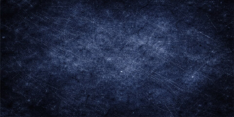 Obraz premium A dark blue grunge background with a textured vintage wall pattern and black paint material provides a blank old paper backdrop for your design