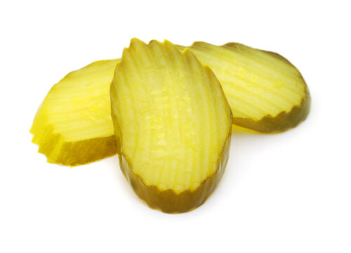 Fresh sliced green pickles isolated over white 