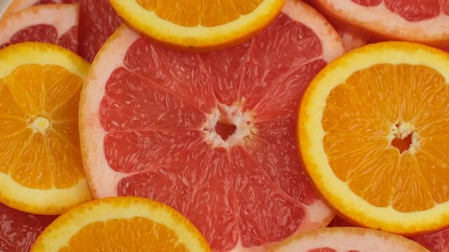 Slice juice grapefruit and orange citrus close up, rotation. Healthy eating, vegan food