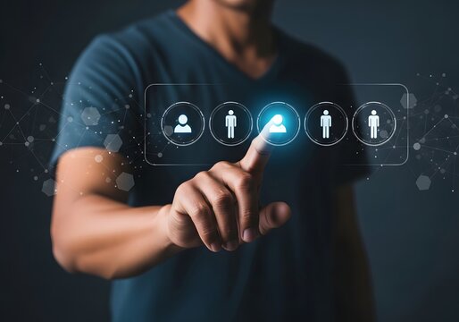 Person selecting profile icon from virtual interface with glowing effect on dark background image