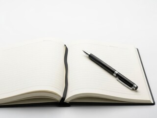 Naklejka premium Open notebook with pen ready for thoughtful writing
