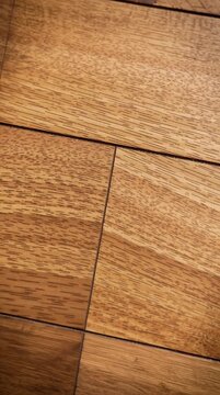 Wood Flooring Texture and Grain: Detailed close-up captures the rich texture and natural grain of high-quality wood flooring, showcasing its intricate patterns, warm tones.