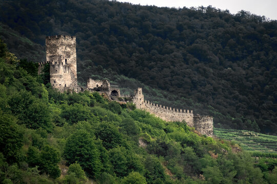 SPITZ, AUSTRIA - 07/13/2019:  The ruins of Hinterhaus Castle on the wooded hills above the town