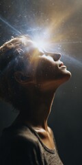 Obraz premium Young caucasian female with radiant light and cosmic aura