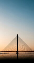 Obraz premium Silhouette of a bridge at sunset.