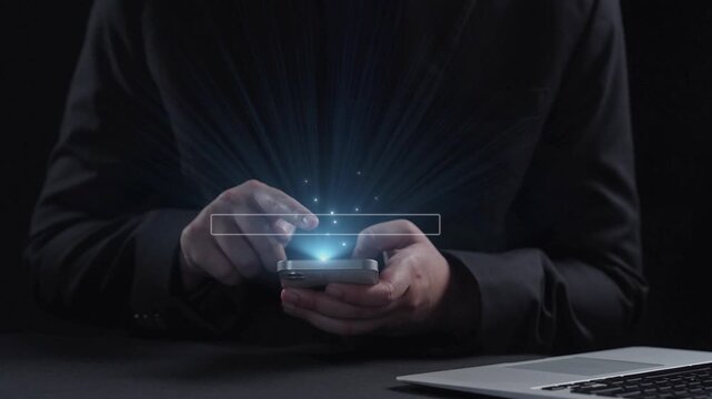 A man uses a smartphone to perform a software update, with a visible progress bar and technological icons floating above, illustrating a modern digital experience. Qubit