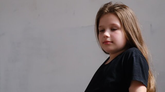 Pretty teenage girl sideways glance, looking, smiling. School play. Casting, audition. Human emotions.
