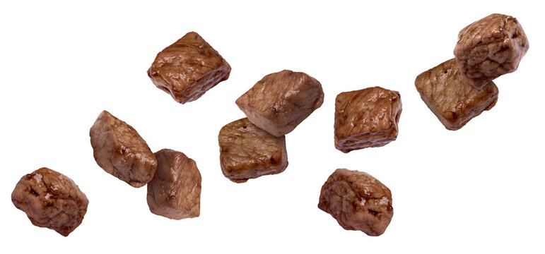 Roasted beef pieces flying in air on white background