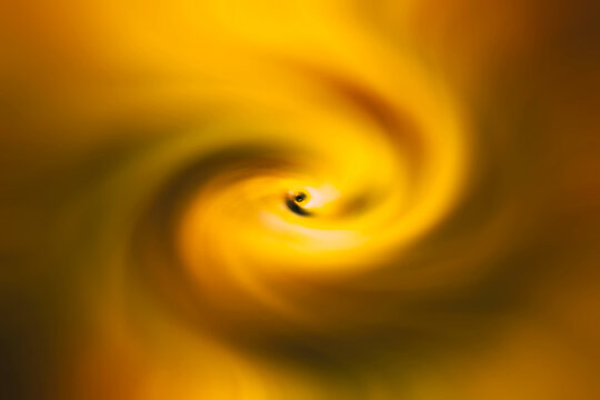 Abstract fractal  orange and gold background with twirl effect.