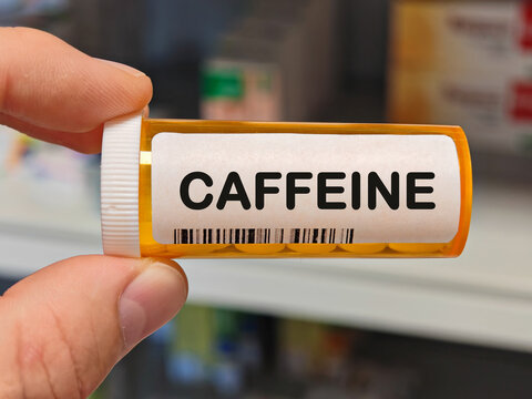 Box of CAFFEINE tablets on a hospital pharmacy table used to improve alertness and reduce fatigue a stimulant.