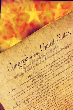 A powerful symbolic image featuring the Declaration of Independence set against a burning American flag, representing themes of freedom, conflict, protest, patriotism, and the ongoing struggle 