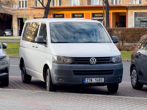 White Volkswagen Transporter T5 TDI minivan car parked on street