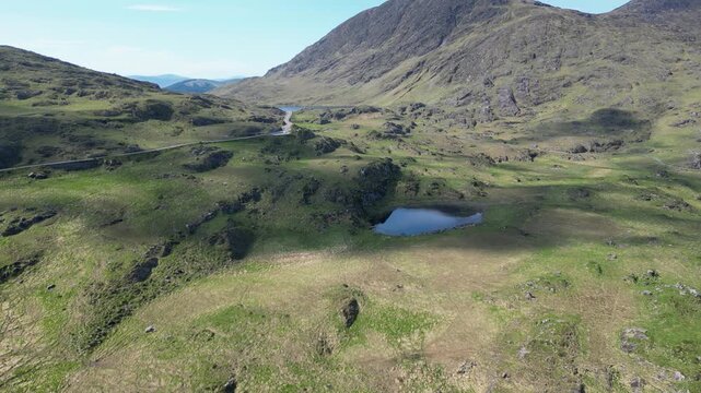 Cinematic drone footage flying forward over the lush landscapes of Killarney National Park. Captured in County Kerry, this shot showcases the untamed beauty of Ireland's oldest national park, featurin