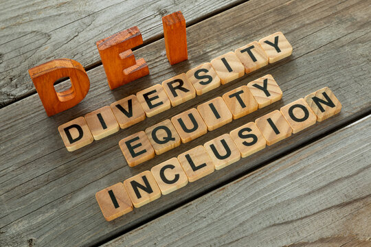 The acronym DEI and its individual words. A concept of diversity, equality and inclusion, aiming to create fair, safe work environment for everyone regardless of personal characteristics.