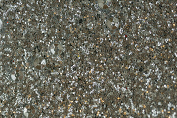 silver glitter background metallic sequins texture silver grey shiny shimmering surface close up...