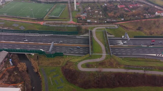 Aerial view of a wildlife overpass crossing a multi-lane highway