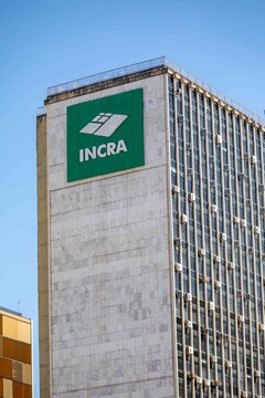 Brasilia, February 1, 2026. Skyscrapers with INCRA and Correios Signs Under Blue Sky