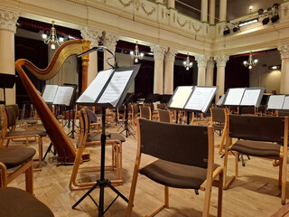 Music score with notes in hall of the conservatory at classical music concert © Harmony Video Pro