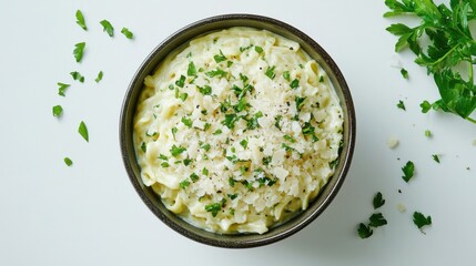 Flat lay creamy pasta carbonara with chopped parsley and parmesan on white background