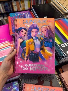 BELO HORIZONTE, MG, BRAZIL, JANUARY 27, 2026 A hand holding a colorful notebook with cartoon characters on the cover Kpop Demon Hunter Huntrix
