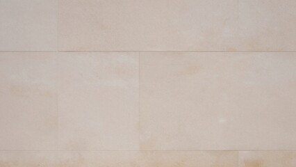 Fototapeta premium Close-up beige wall composed 12x24 inch porcelain tiles arranged grid pattern each tile has smooth