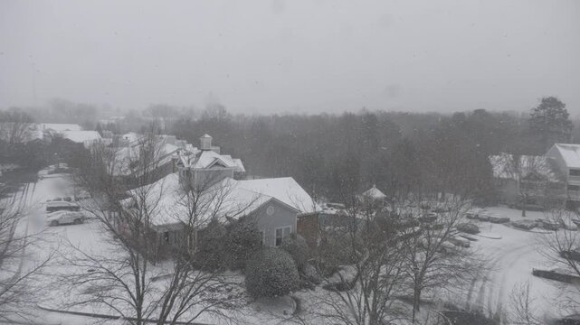 Winter Storm Gianna in Greenville, South Carolina. Strong Snow Blizzard in Winter, Greenville, South Carolina. Blizzard Strong Wind And Heavy Snow Lash Town. Heavy Snowstorm in Residential Area.