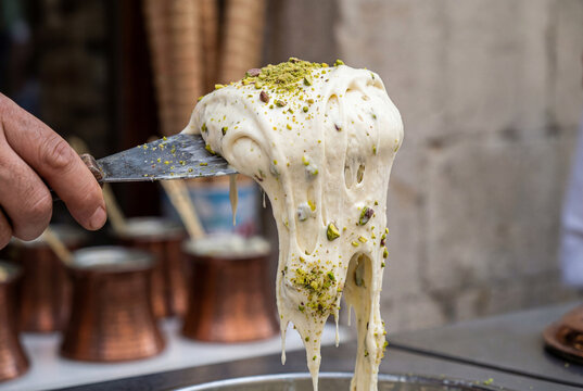 Turkish Dondurma Ice Cream with Paddle Topped with Pistachios 