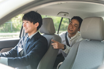 Male customer getting in a taxi and giving directions © buritora