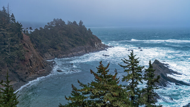 Panorama of the foamy waters on a foggy afternoon at Cape Arago State Park near Coos Bay, Oregon, USA
