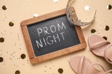 Chalkboard with text PROM NIGHT, high heels, tiara and confetti on beige background © Pixel-Shot