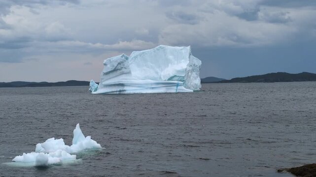 A large iceberg floating and melting in Gillot Cove at Twillingate (Newfoundland, Canada)