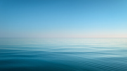 A serene wide-angle view of a calm turquoise ocean with a clear horizon line under a soft blue sky and gentle white clouds, creating a peaceful and minimalist landscape. © Lumi Stock Studio