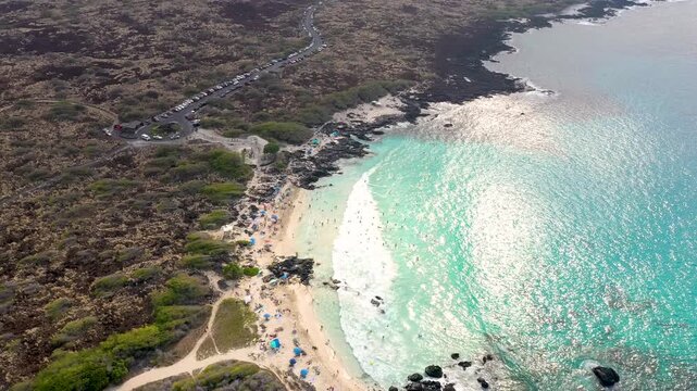Aerial View of Tropical Blue Lagoon with Gimbal Tilt Down Over Beach, Big Island Hawaii