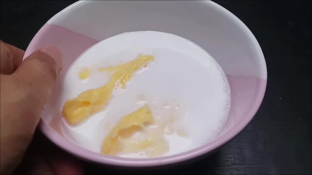 Footage of Sweet Fermented Cassava Dessert with Coconut Milk