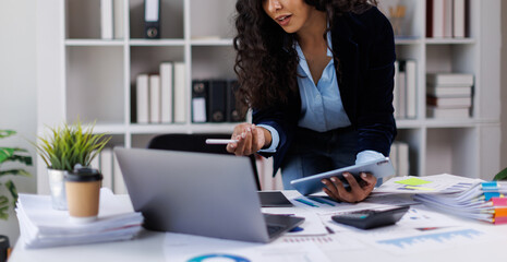 African american female financial consultant or analyst working with them team, brainstorming and...