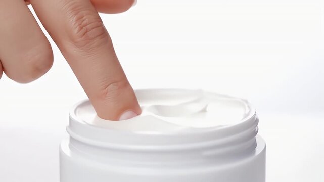 Applying White Moisturizing Cream with Finger Tips on Seamless White Background for Skin Hydration Advertisement