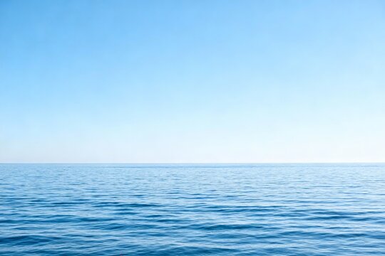 Calm blue ocean under clear sky
